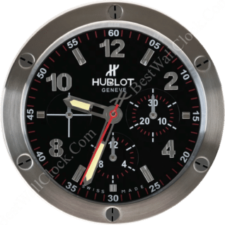 Hublot wall clock with black dial, stainless steel frame, bold numerals, three subdials, luminous hands, red seconds hand, and exposed screw design.